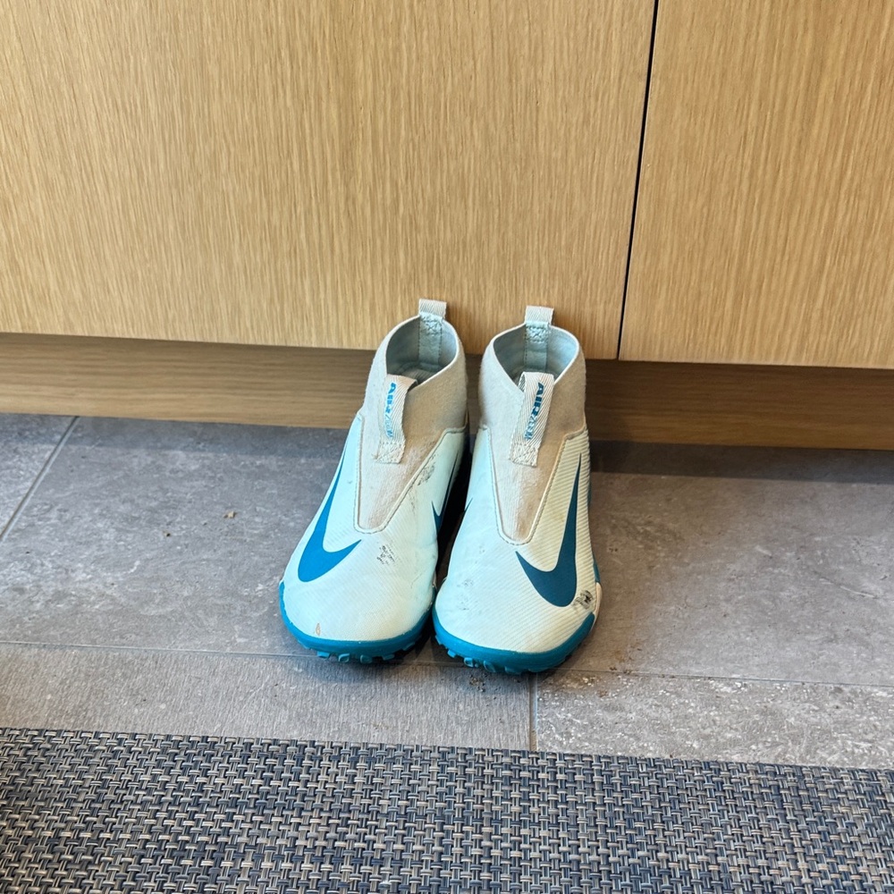 Nike Kids Teal and Blue turf soccer shoes